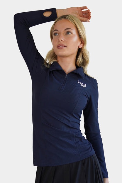 Lemii Label - Woman wearing a navy blue long-sleeve athletic shirt with a Lemii Label logo on a white background